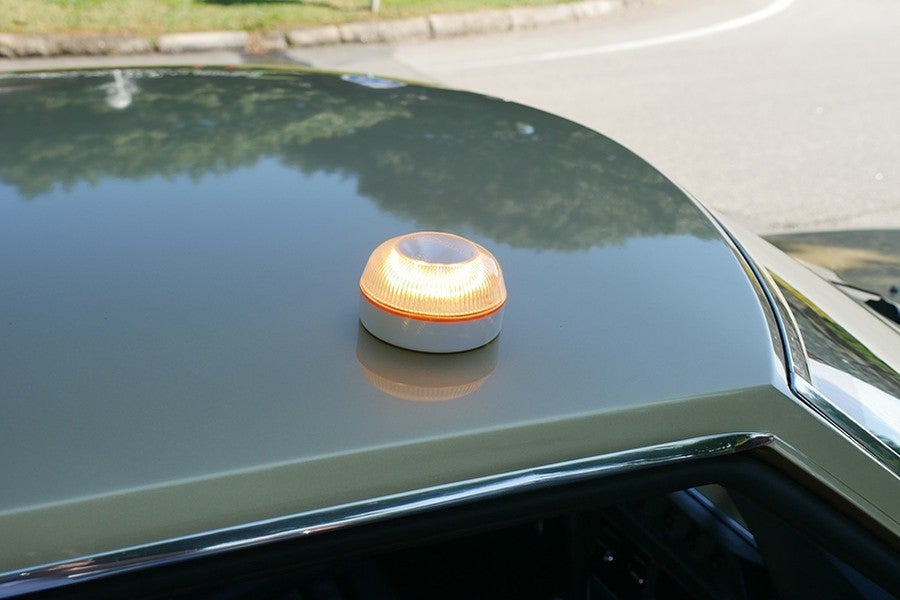 The light turns on automatically when attached magnetically.